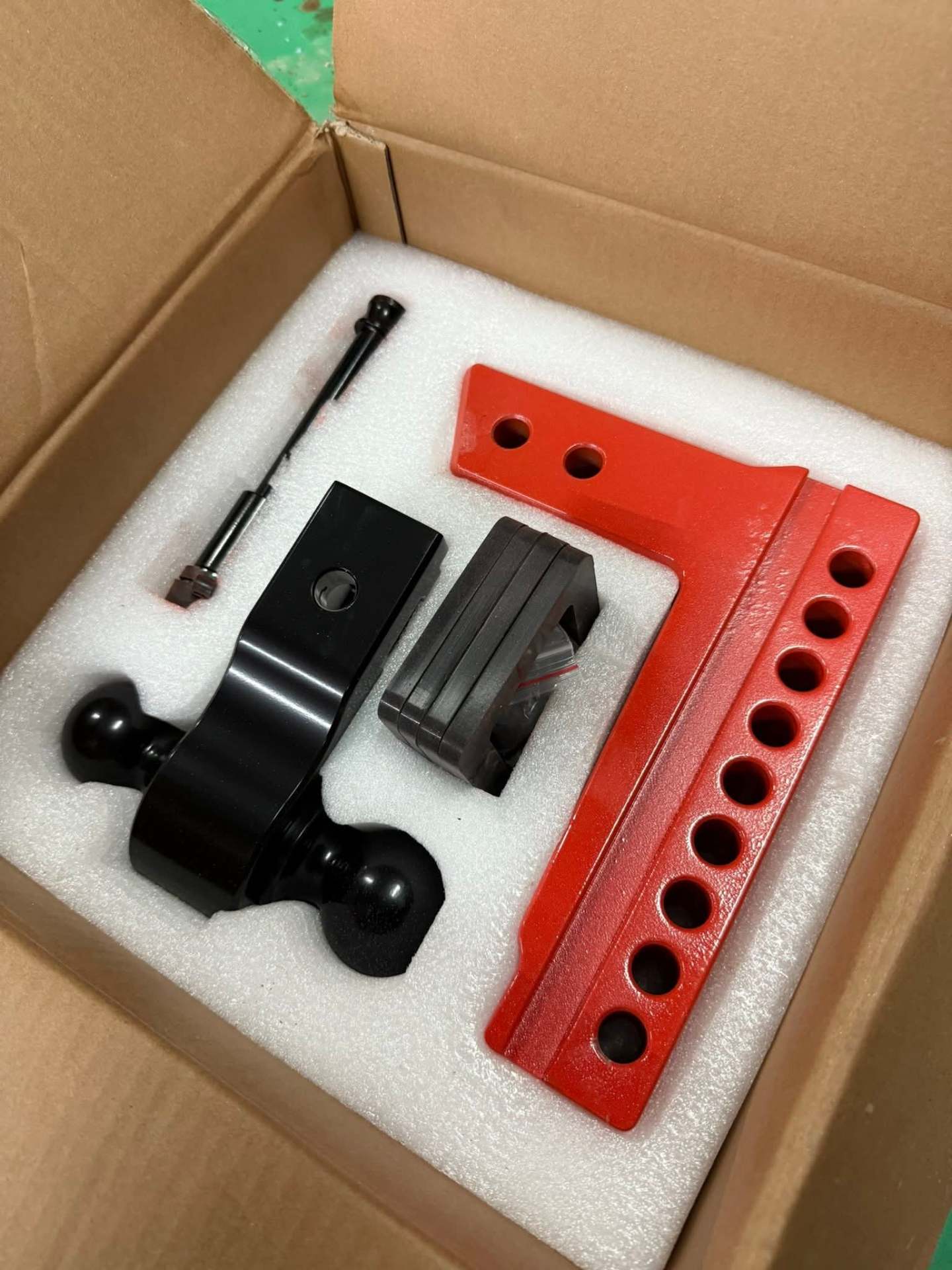 Red and black adjustable hitch with dual-ball mount