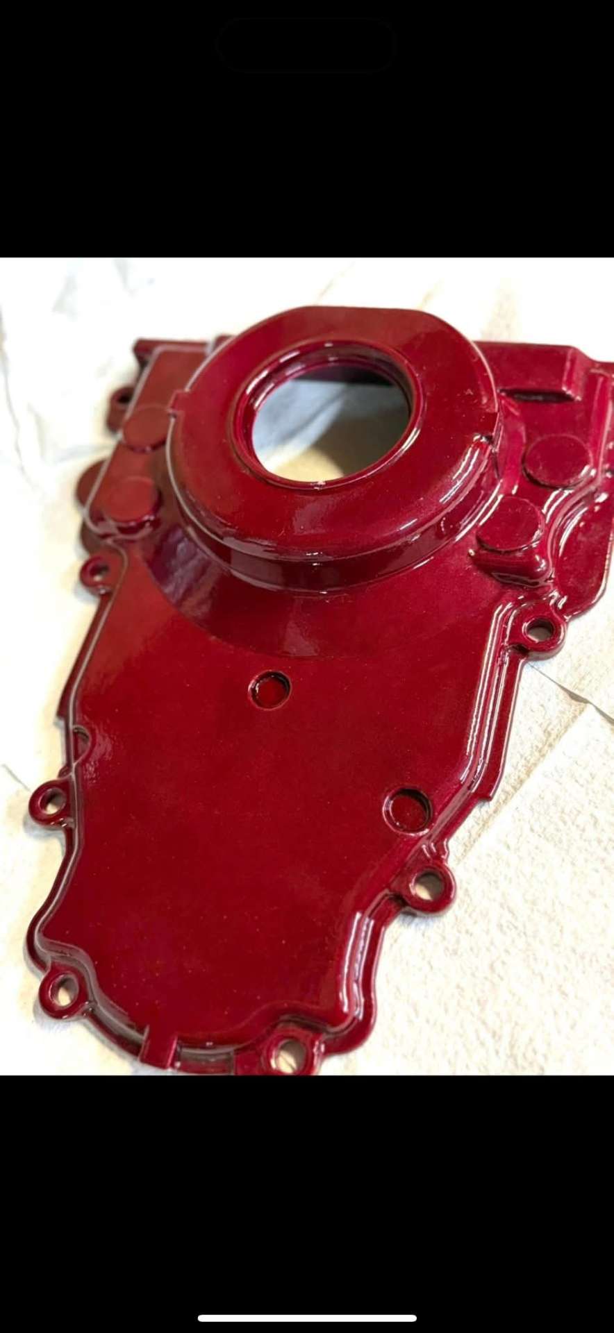Red powder-coated engine timing cover